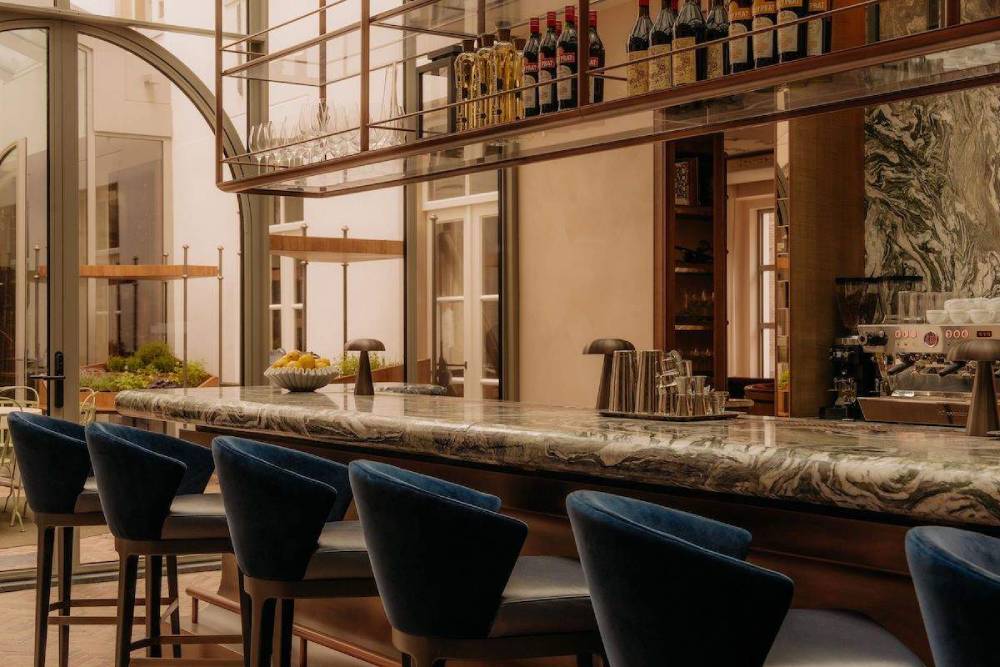 room with tables and concorde model on ceiling